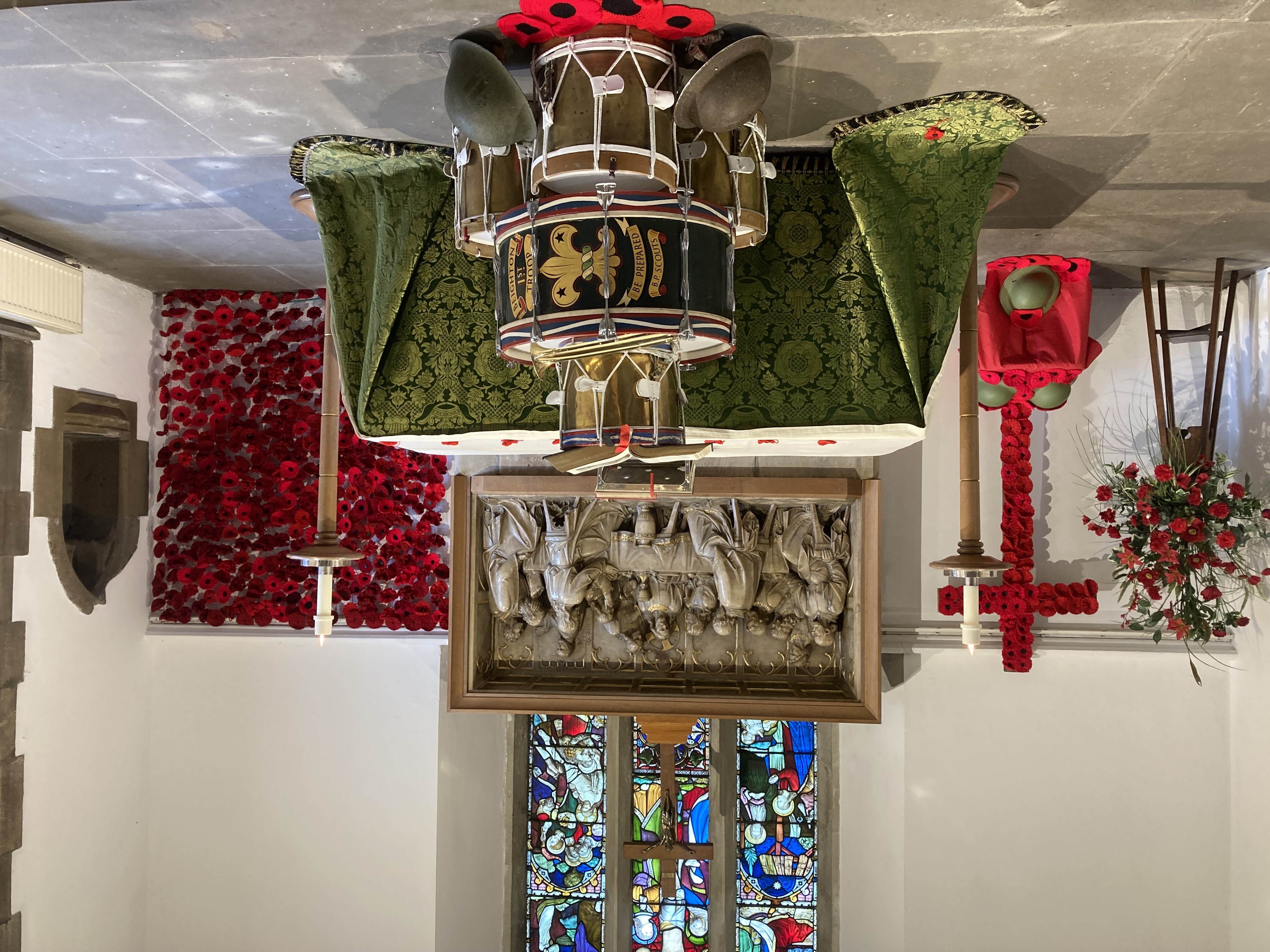 Drums, Bible and poppy display at church for Remembrance Sunday.